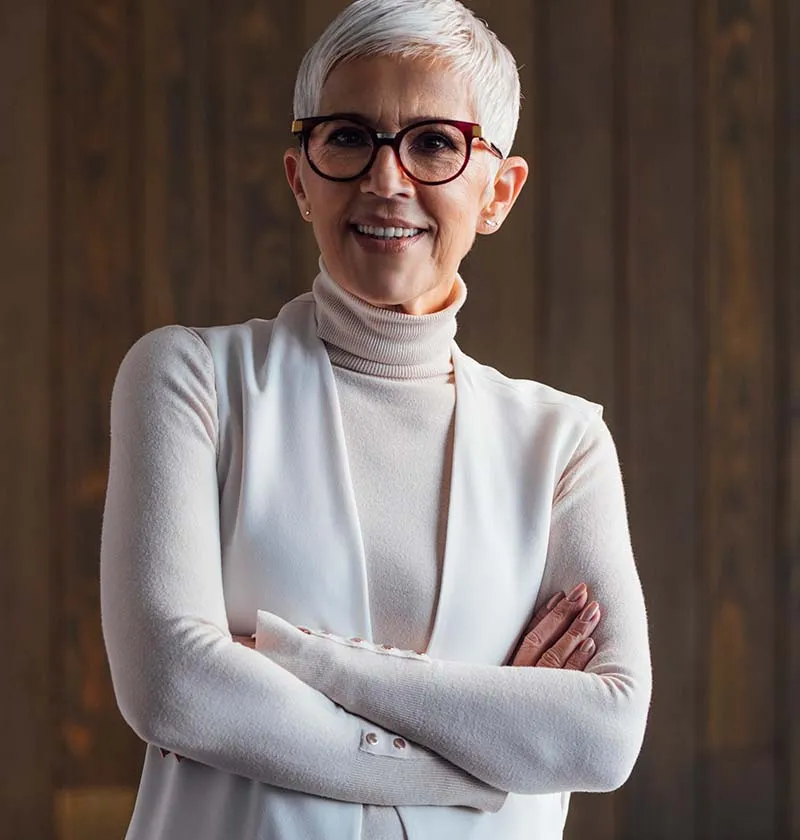 Older woman with white hair smiling